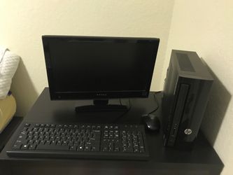 HP computer with monitor, mouse, and keyboard.