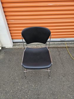 Black Stackable Chair with Reclining Back