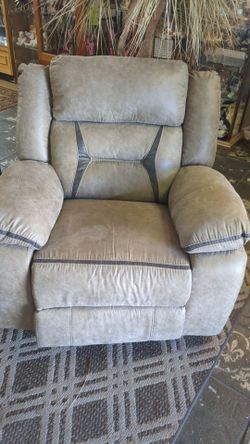 Beautiful and super clean light greyish rocking/swivel chair. Does not recline.