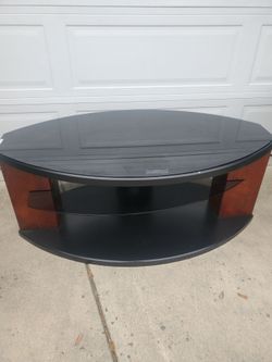 T.v. stand dark class like new 4x2inch.