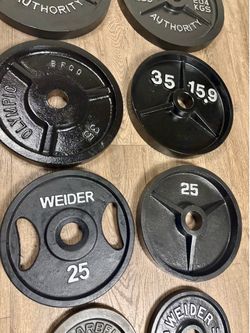 Full set of Olympic Cast Iron Weight Plates; all Reconditioned good as NEW . Total: 246 lbs