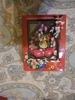 vintage 1996 Looney Tunes collectible ornament features Sylvester and Tweety swinging on a candy cane heart