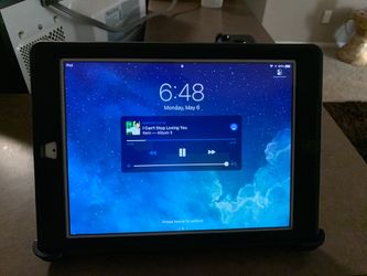 iPad Thin with Outterbox defender hard case with 3 positions stand.