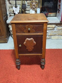 Vintage wood nightstand with a single drawer and turned legs