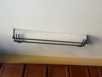 Ceiling light fixture. Bronze metal styling with white heavy duty mottled plastic light cover.