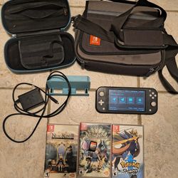 Modchipped Switch Lite with accessories, games, and charger
