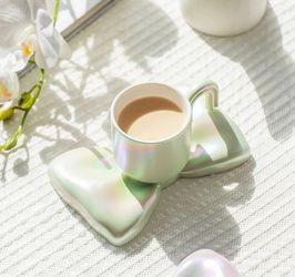 Very original bow tea/coffee cup with tea spoon and saucer. Holiday, gift for her