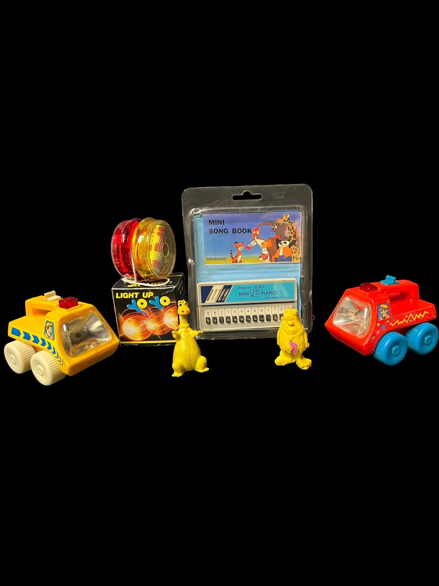 Vintage 80s toys lot, mini piano, light up yo yo, flintstones erasers and 1983 flashlights cars