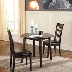 New In Box. Ashley's Furniture. Hammis Round Drop Leaf Dining Extendable Table  (No Chairs)  Store Price $160