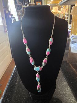 Sterling silver necklace with oval composite "Cotton Candy Turquoise" cabochons.