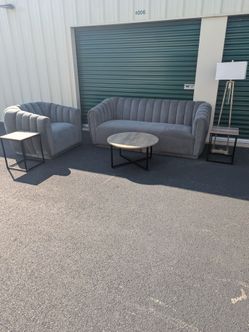 Modern grey 2pc sitting set with matching ta bles and lamp