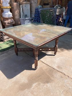 Antique dining table with glass top