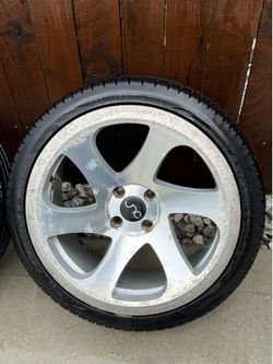 Four lug Rims with all season tires on 3 of the rims