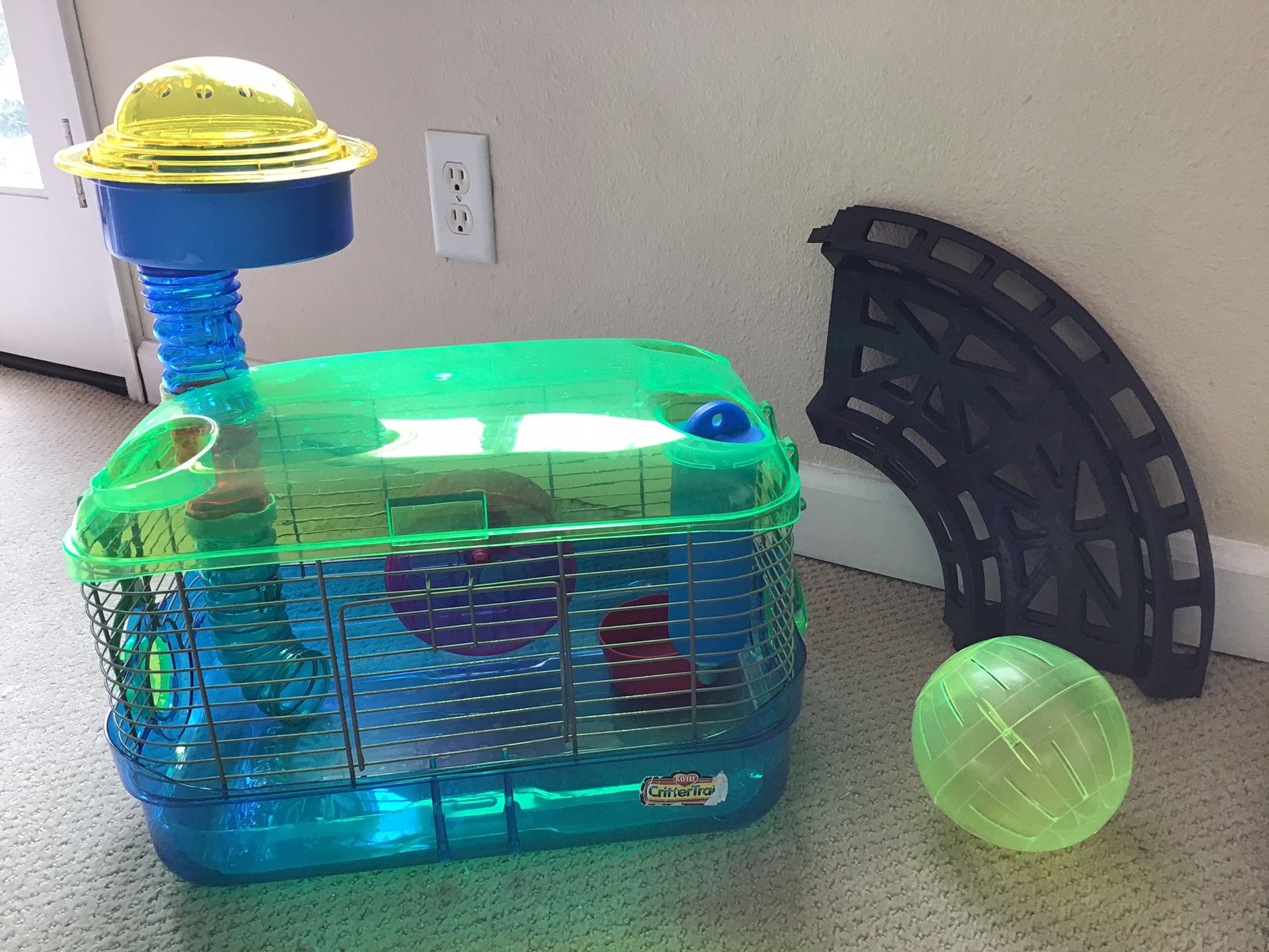Hamster Cage with wheel, “lookout”, rolly ball, ball track, and bedding.