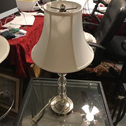 Three glass tables and lamps