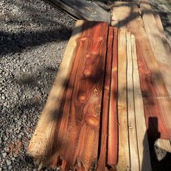Stack Of Redwood And Cedar Boards And Live Edge Planks