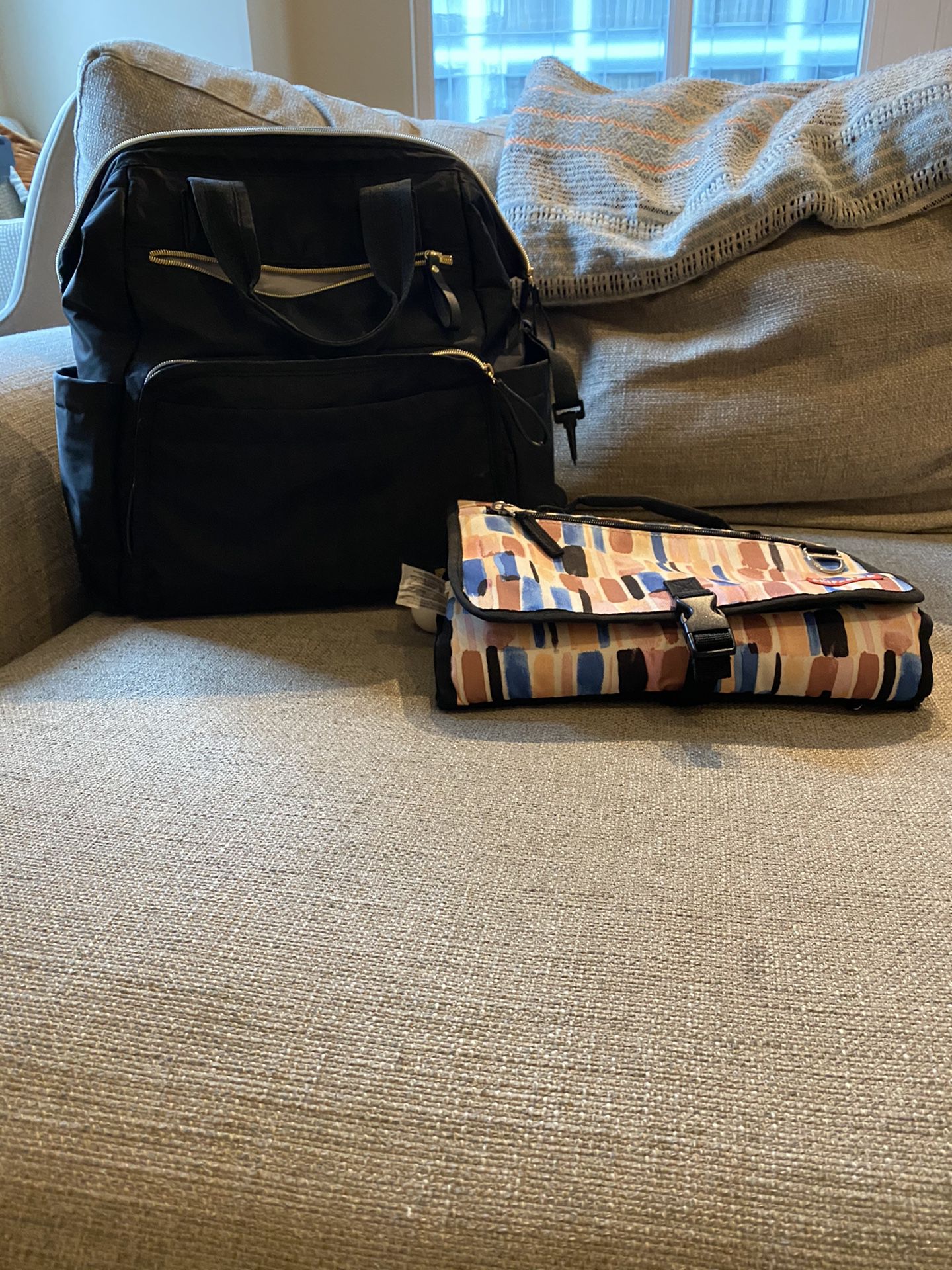 Skip hop diaper bag and portable changing pad
