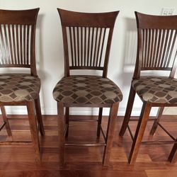 Three Cherry barstools With Upholstered Seats