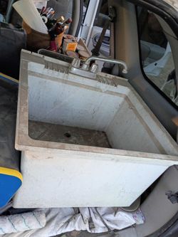Wash basin fiberglass hardware is connected not broken or cracked good condition just dirty