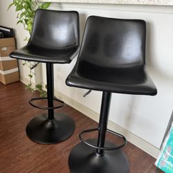 Pair of Black Leather Adjustable Bar Stools