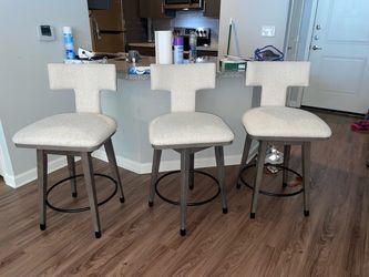 Upholstered swivel bar stool