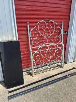 Twin size metal bed.