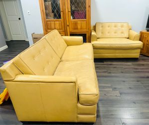 Mid century modern style leather pull out couch and love seat