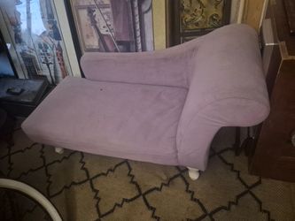 lavender chaise lounge is a HomePop Diva Juvenile model with a curved back and white legs