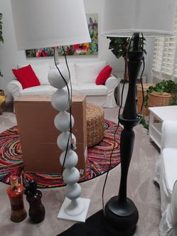 Two tall floor lamps