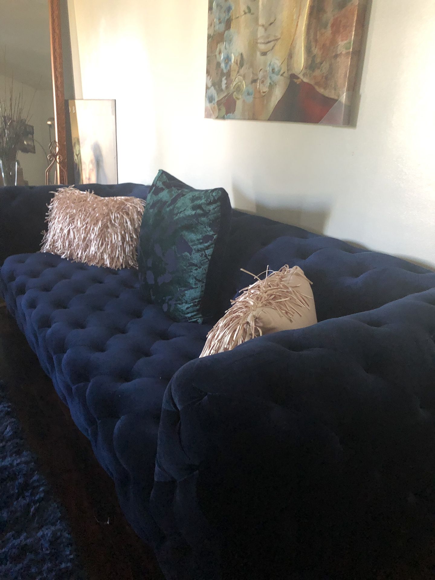 Velvet blue tufted sofa