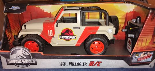 Jada Toys Jurassic World Hollywood Ride Jurassic Park Jeep Wrangler Remote Car Hollywood Rides Jurassic Park Jeep Wrangler - 1:16 Scale Radio Control 