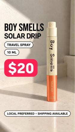 Boy smells Solar Drip Travel Spray