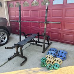 Squad rack adjustable bench bar and weights all Olympic about 200lbs