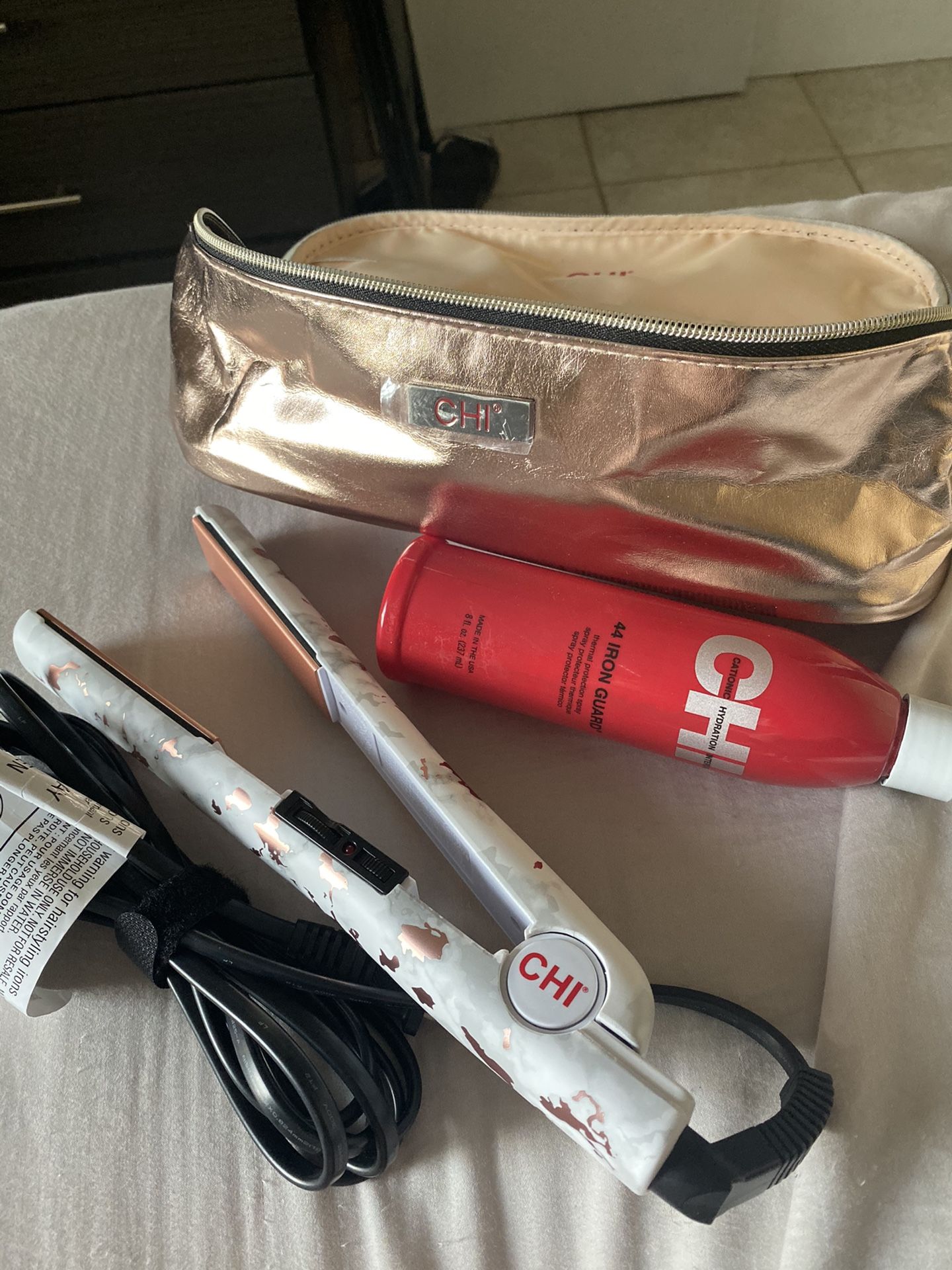 CHI hair straightener with bag and heat protectant spray