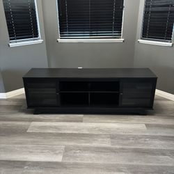 Black Entertainment Center with Glass Doors and Adjustable Shelves