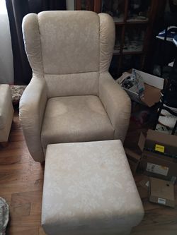 Two chairs with ottomans
