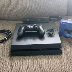  "Sleek PlayStation 4 Bundle with Games for Gaming Bliss!" 