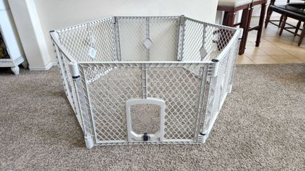 Indoor/Outdoor 6 Panel Portable Pet Playard with Door. Each panel measures: 34.5"W 1"D x 26"H