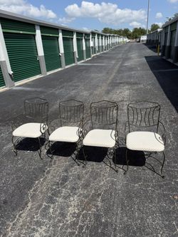 Set Of Four Wrought Iron Chairs.