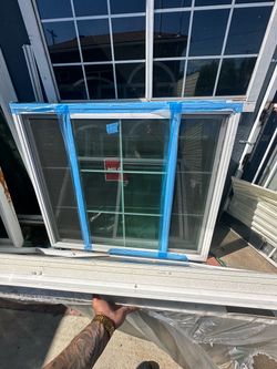 New Milgard vinyl sliding window is white with a built-in grid pattern.  Price is firm  and price is for each window I have 2 available the size is in