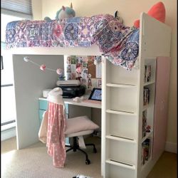 A loft bed with desk 