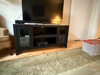 Black TV stand (console) with glass doors