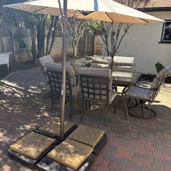 Patio set including umbrella