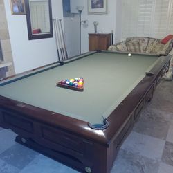 Brunswick pool table with bronze base rails