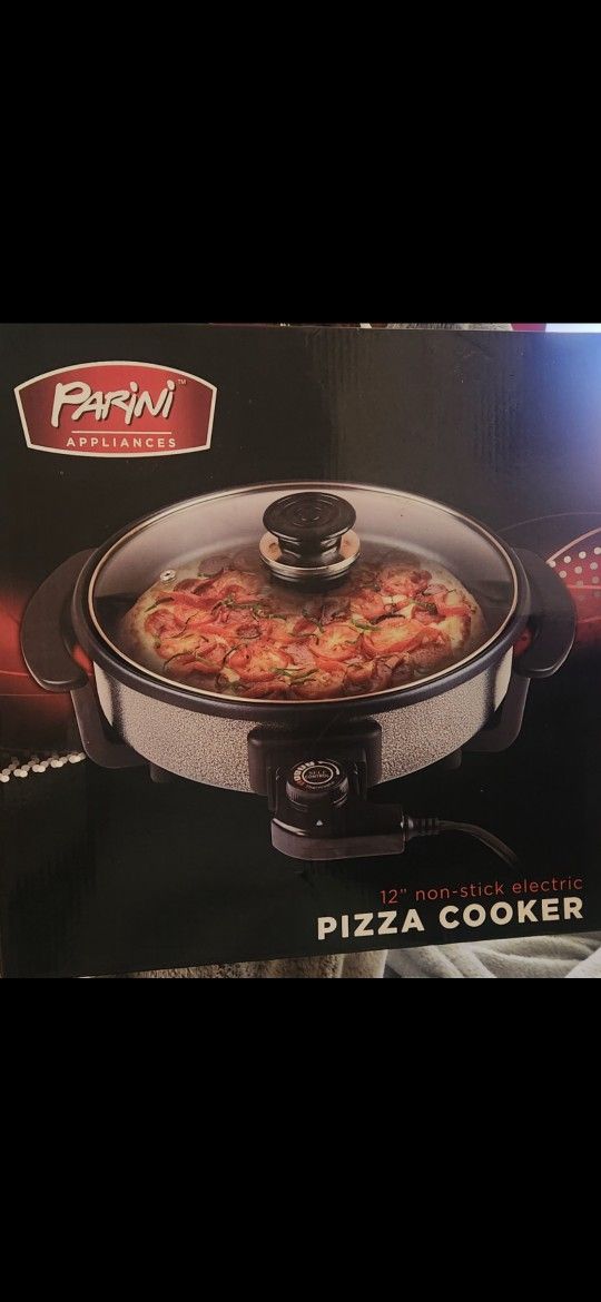 Pizza Cooker. $30 All Details In The Box