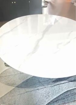 53-inches round dining table .Marble white color  top with black and golden base. Also,round carpet.