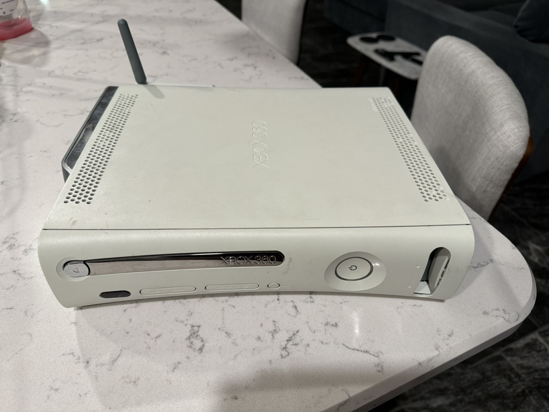 Xbox 360 Console, Wireless Adapter, and Three Wireless Controllers