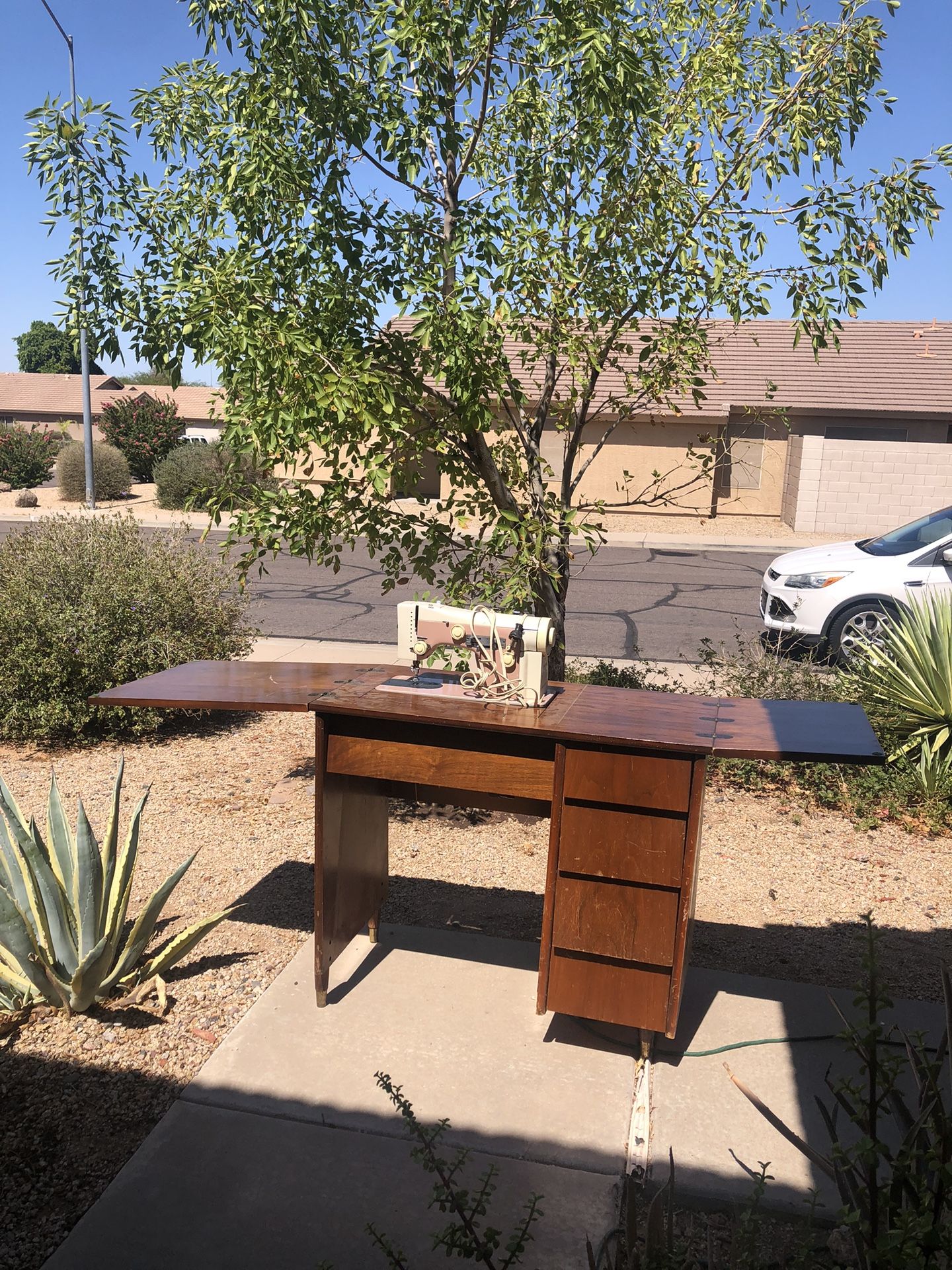 Antique Sewing Table With a Sewing Machine