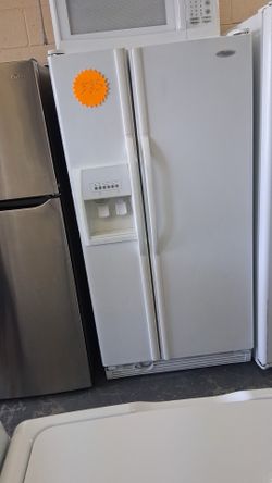 Nice Whirlpool white side by side refrigerator