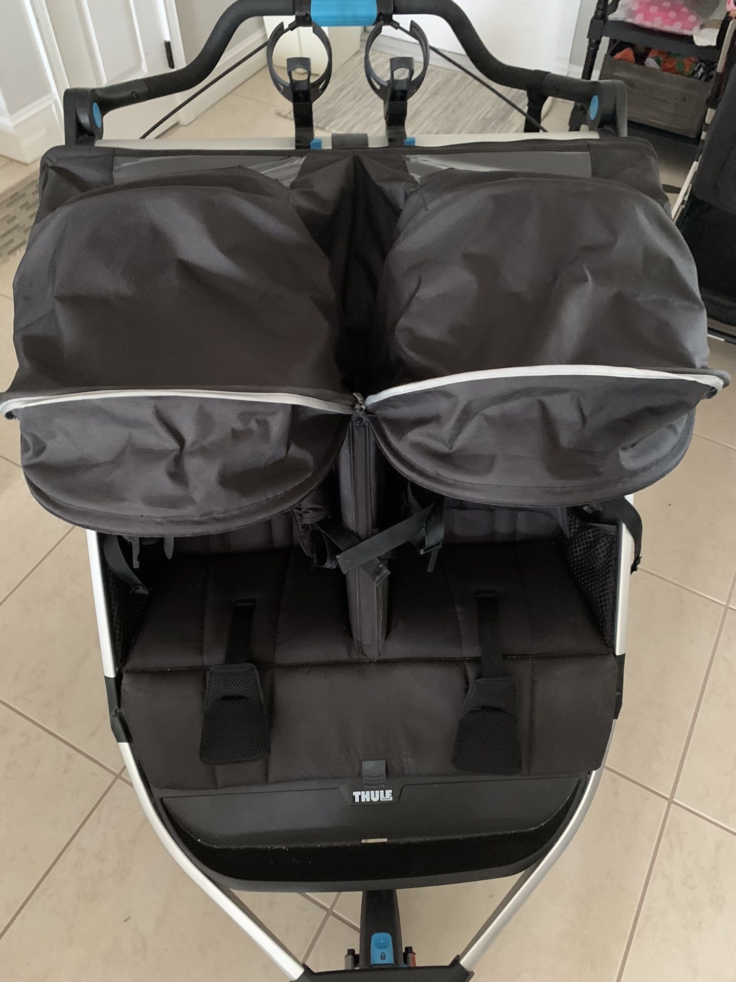 Thule Urban Glide 2 Double Stroller rain and mosquito cover included Running Jogging Walking Great for theme parks. Comes with cup holders